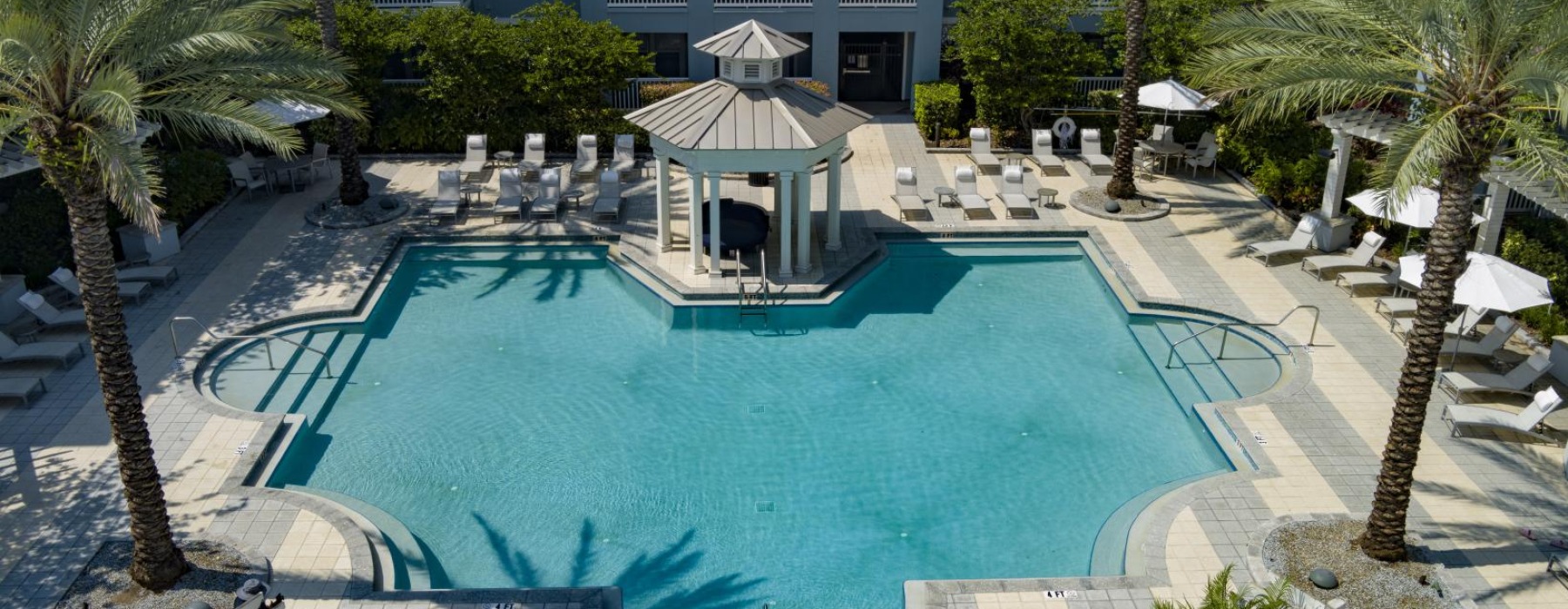 a pool with a building in the background