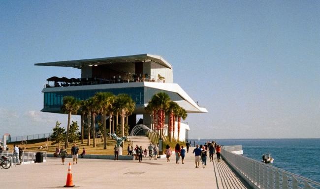 a boardwalk next to a beach